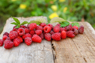 raspberries on a table, 
raspberries on wooden background