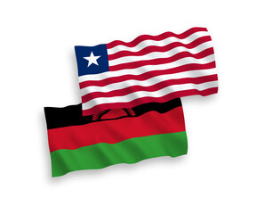 National vector fabric wave flags of Malawi and Liberia isolated on white background. 1 to 2 proportion.