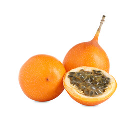 Whole and cut delicious granadillas on white background