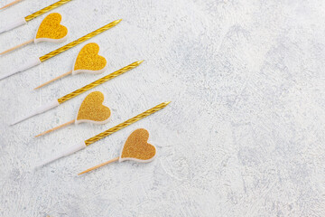 Golden heart shaped candles for valentine's day.