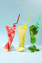 Refreshing summer drinks. Fresh drinks with ice. Cold lemonades: watermelon lemonade, lemon and mint are the best to quench your thirst in the summer heat. Watermelon, lemon, mint. Close-up. Copyspace