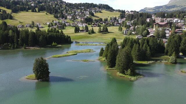 Drone view of the lake at Valbella on the Swiss alps

