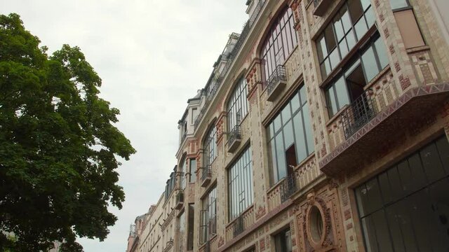 Art Deco Building In Rue Campagne Premiere, 14th Arrondissement Of Paris, France. Bow Window And Balcony Of An Artist Studio. low angle, slider right