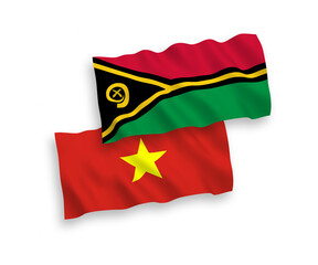 National vector fabric wave flags of Republic of Vanuatu and Vietnam isolated on white background. 1 to 2 proportion.