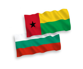 National vector fabric wave flags of Bulgaria and Republic of Guinea Bissau isolated on white background. 1 to 2 proportion.