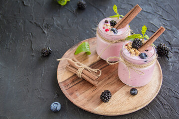 Healthy smoothie of fresh summer berries. Creative atmospheric decoration