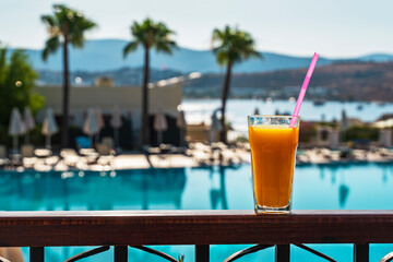 cocktail on the beach. glass of freshly squeezed orange juice. Orange fresh . Summer and healthy food concept