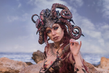 beautiful girl in the costume of the sea witch Ursula, against the background of the sea, close-up, portrait