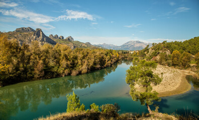 The turquoise waters of Köprüçay, a rafting center, and the yellow of autumn around it