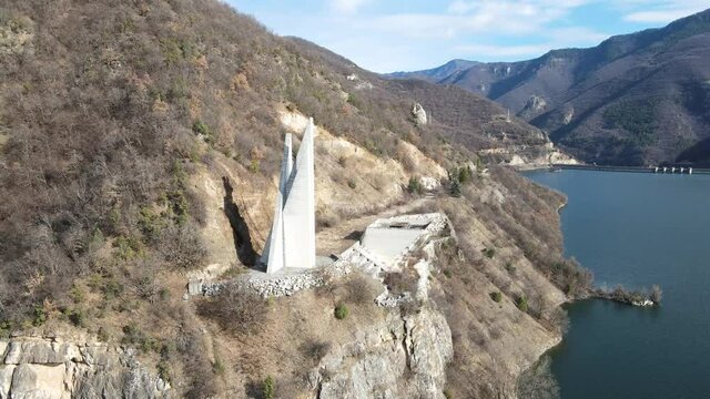 Aerial view of Memorial of Rhodope partisan detachment Anton Ivanov at the coast of The Vacha Reservoir,  Bulgaria
