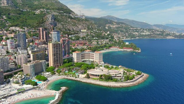 Monte Carlo, Monaco. Aerial view of famous city towering over Mediterranean Sea, modern high-rise buildings, Les Plages beaches  - landscape panorama of Europe from above