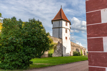 Fototapeta na wymiar Outer fortification wall with tower of Wilhelmsburg Castle