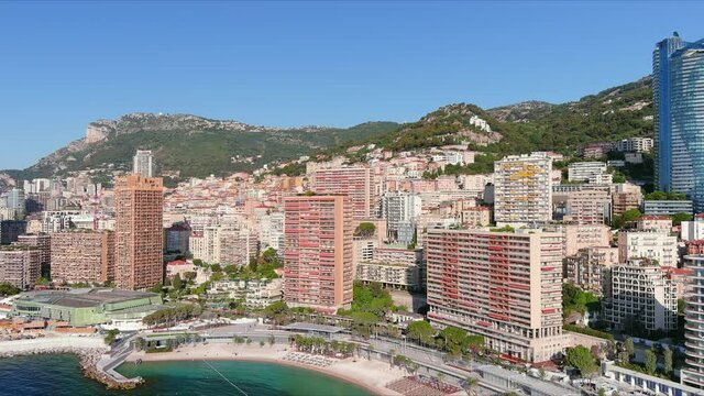Monte Carlo, Monaco. Aerial view of famous city towering over Mediterranean Sea, modern high-rise buildings, Les Plages beaches  - landscape panorama of Europe from above
