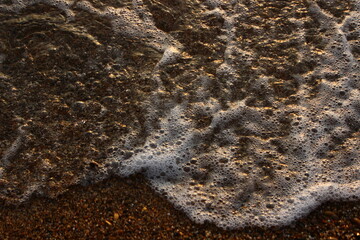 Fototapeta na wymiar wave on the sand 