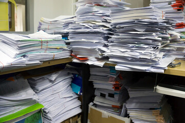 Busy, messy and cluttered workplace, full of documents