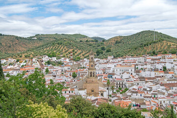 Constantina, one of the most beautiful villages of the North Seville Mountain with the church in the center of the photo, Andalusia, Spain