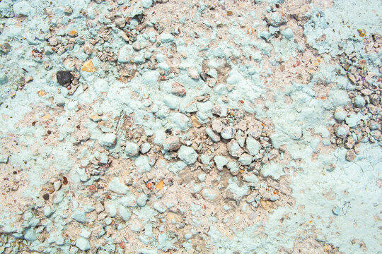 painted stone slab with stones and blue paint