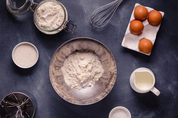 Table with baking products and tools.