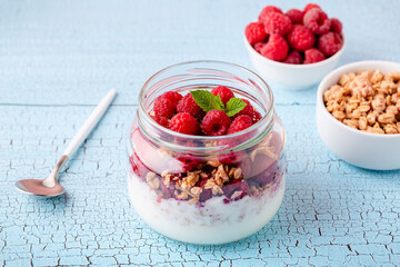 Healthy breakfast. Granola / muesli yoghurt and fruit.