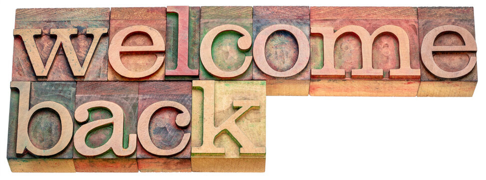 Welcome back banner - isolated text in letterpress wood type, hospitality or business reopening concept