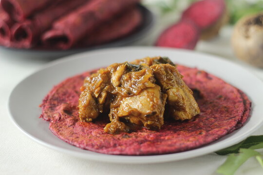 Beetroot Paratha is a Indian pan fried whole wheat flatbread made of wheat flour kneaded with fresh grated beetroot and spices. Served with chicken gravy curry.
