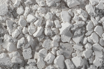 Abstract background from white limestone stones.