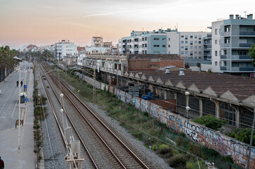 Fototapeta na wymiar Barcelona, ​​Spain; April 25, 2021: Cityscape of train tracks on the outskirts