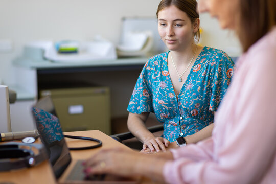 Young Female At Medical Appointment In Doctors Surgery