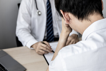 A male patient showed signs of stress after being diagnosed with a serious illness after attending an annual health check. Annual health check-up concept for timely treatment of disease.