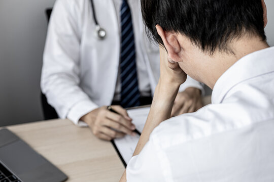 A male patient showed signs of stress after being diagnosed with a serious illness after attending an annual health check. Annual health check-up concept for timely treatment of disease.