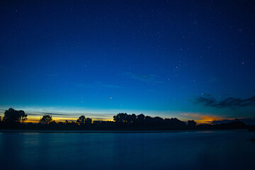 Obraz na płótnie Canvas Night river and starry sky