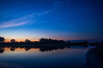 Obraz premium Night river and starry sky