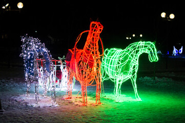 New Year's light installation in the form of horses and fairy sleigh