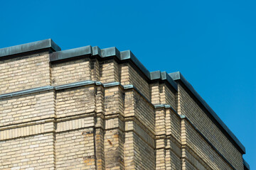 detail of an historic art deco yellow brick building in the city