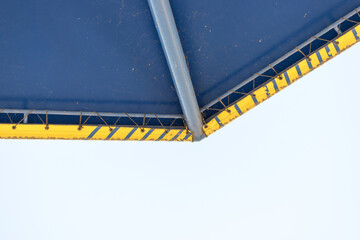 yellow and blue patio umbrella - detail