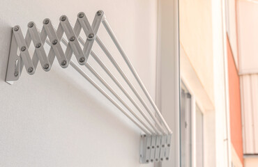 Modern clothes hanger on balcony, housework concept background photo