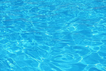Fototapeta na wymiar Blue water in swimming pool, Texture or background.