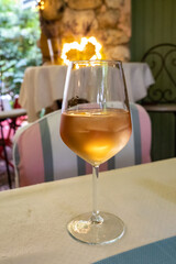 Summer on French Riviera Cote d'Azur, drinking cold rose from Cotes de Provence on outdoor terrase in old cafe, Var, France