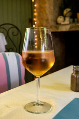 Summer on French Riviera Cote d'Azur, drinking cold rose from Cotes de Provence on outdoor terrase in old cafe, Var, France