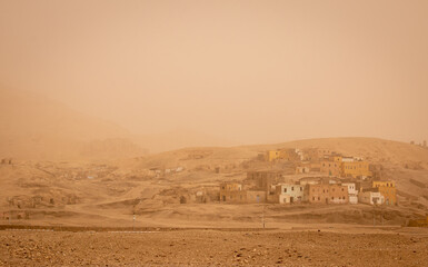 Luxor looking orange early in the morning after a sand storm, Egypt