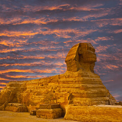 Fototapeta na wymiar Sphinx against the backdrop of the great Egyptian pyramids. Africa, Giza Plateau.