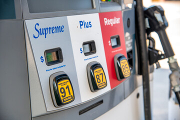 Supreme, Plus, Regular gasoline at gas station pump. - obrazy, fototapety, plakaty