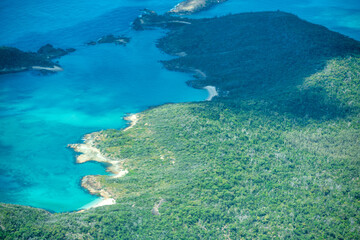 Fototapeta na wymiar Aerial view of Whitsunday Islands National Park from the aircraft.