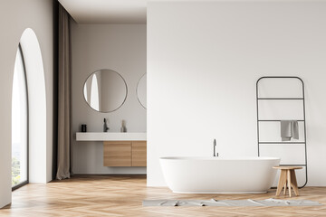 Fototapeta na wymiar Bathroom with arch window, vanity, bathtub and wooden details