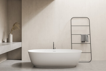 Obraz na płótnie Canvas Minimalistic beige bathroom with tub and rail