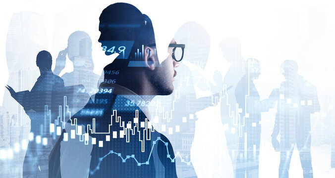 Businessman in glasses and suit looking at financial graphs, candlesticks and silhouettes of colleagues. Analytics for investment solution. Double exposure. New York skyscrapers cityscape background