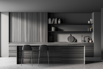 Dark grey wooden kitchen with two stools