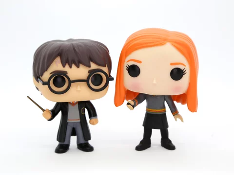 Funko Pop Ginny Weasley and Harry Potter in their Hogwarts School
