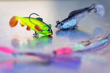 Green and blue sparkly fish bait, colorful plastic fish hook
