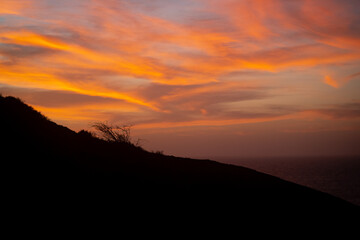 Reddish Sunset Shows a Sky with Orange Clouds at the Punta Gallina Lighthouse, La Guajira, Colombia